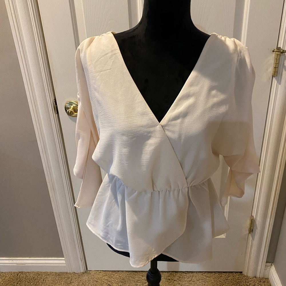 This top is so pretty on but was too small for me. It is so angelic and whispy.